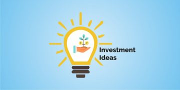 A bright light bulb with a plant growing in a hand inside it, symbolizing investment ideas, against a blue background. Rays of light emanate from the glowing bulb, indicating it is on or shining brightly. To the right of the light bulb, “investment ideas” is written in bold black letters.