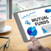 5 steps to analyze mutual funds for better investments 2 A person looking at a tablet computer with a financial news app on the screen. The text “mutual funds” is written on the screen.