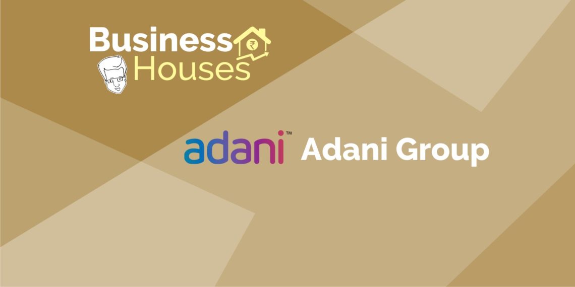 A logo for the adani group, an indian multinational conglomerate headquartered in ahmedabad, gujarat, india. The logo includes the stylized name “adani” in blue letters, with a curved orange line underneath.