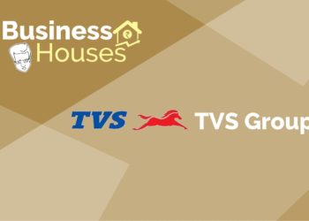 A graphical representation of a business house tvs group with logo in a brown background.