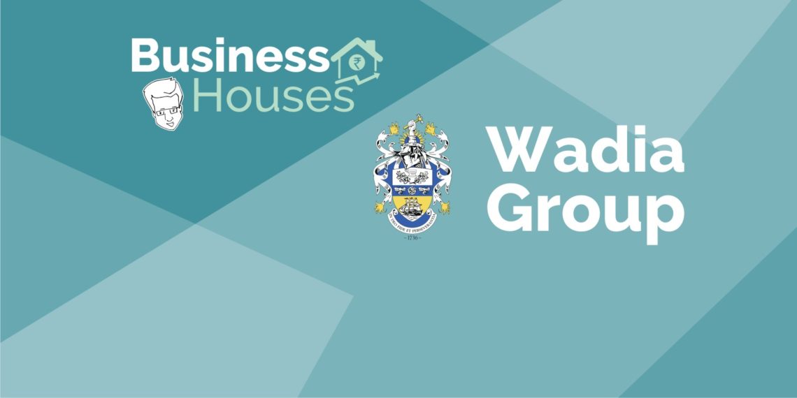 A graphic image with a blue and green background with the text ‘business houses’ and ‘wadia group’ and a coat of arms in the center.
