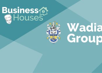 A graphic image with a blue and green background with the text ‘business houses’ and ‘wadia group’ and a coat of arms in the center.