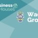 Wadia group - trust in god and perseverance 17 A graphic image with a blue and green background with the text ‘business houses’ and ‘wadia group’ and a coat of arms in the center.