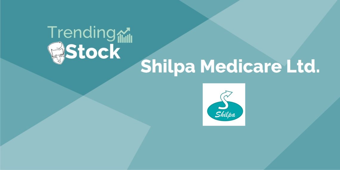 A blue background with a logo for shilpa medicare ltd. , a pharmaceutical company, in the center. The logo is white and blue and consists of the company's name in a stylized font.