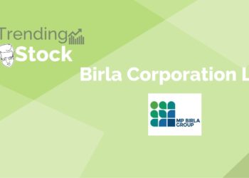 A man in a business suit standing in front of a green backdrop with the birla corporation logo and the text "trending stock" above it.