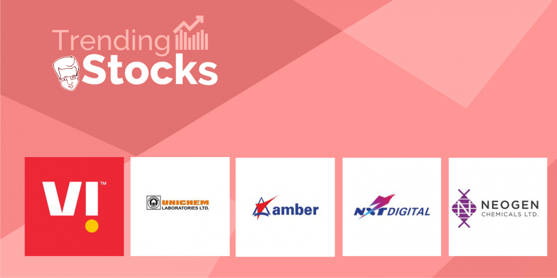 A pink background displays a title 'trending stocks' followed by logos and names of five companies: vi, unichem laboratories ltd, amber chemicals ltd, nt digital, vodafone idea, and neogen laboratories ltd. 