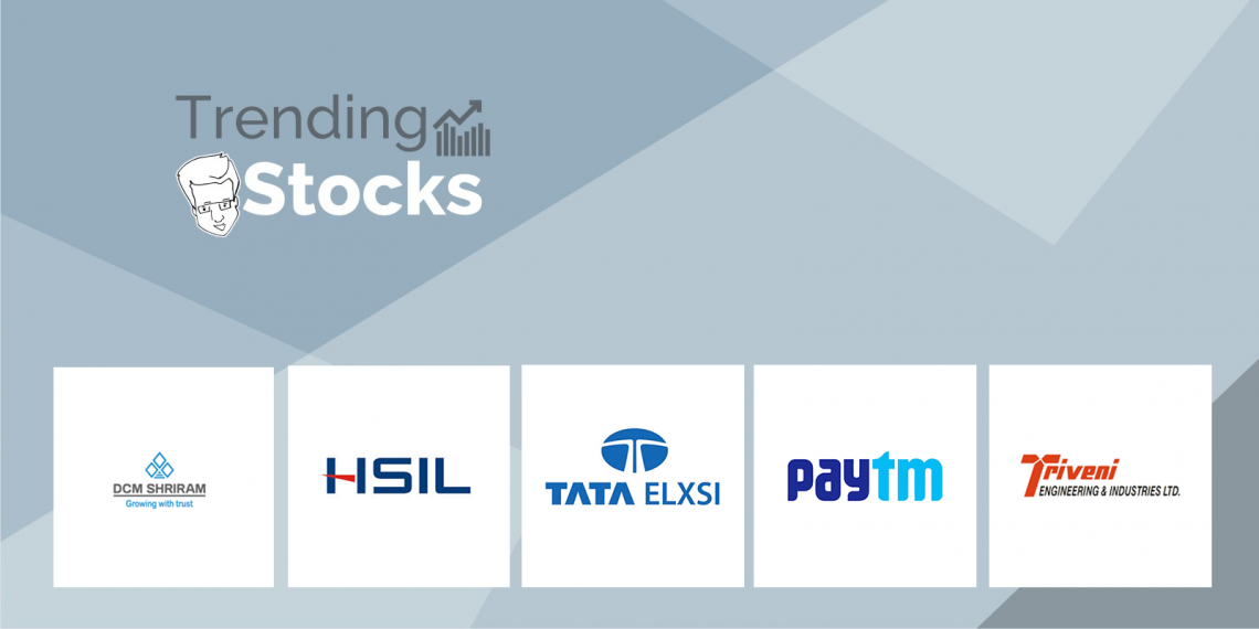 A graphic displaying “trending stocks” with logos of dcm shriram, hsil, tata elxsi, paytm, and triveni engineering & industries ltd. Below.