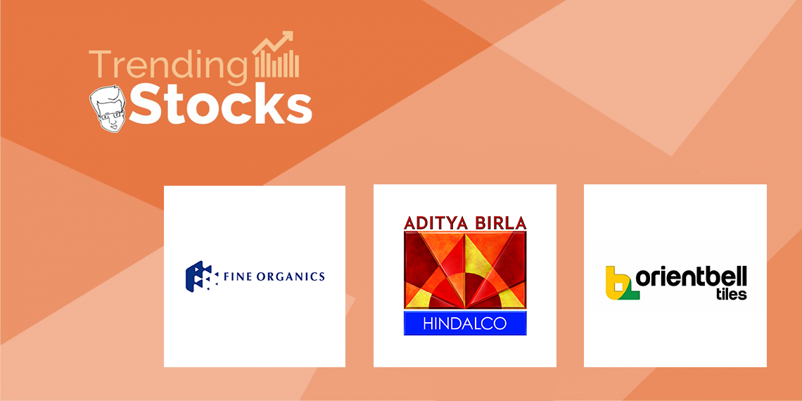 A graphic representation with logos of trending stocks in a gradient background of red and orange.